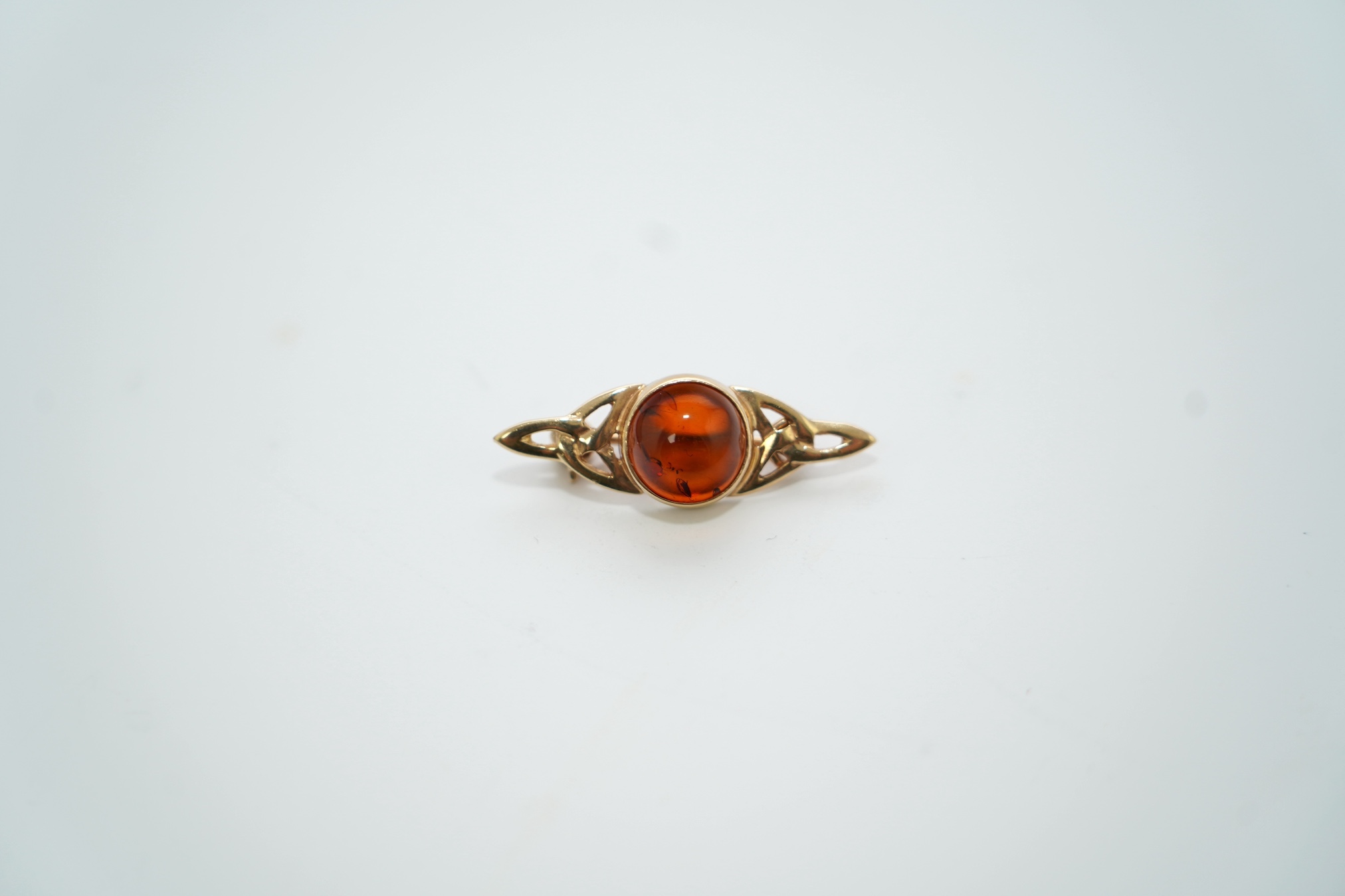 A modern suite of 9ct gold and amber set jewellery, comprising a necklace, 38cm, brooch and pair of drop earrings, gross weight 11.2 grams. Condition - good